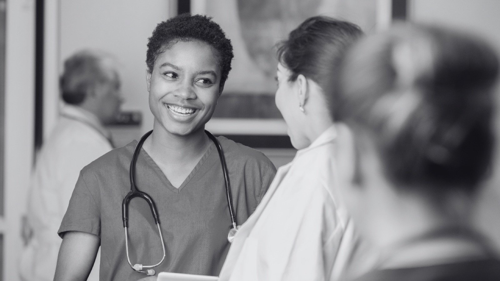 A clinician talking with a patient